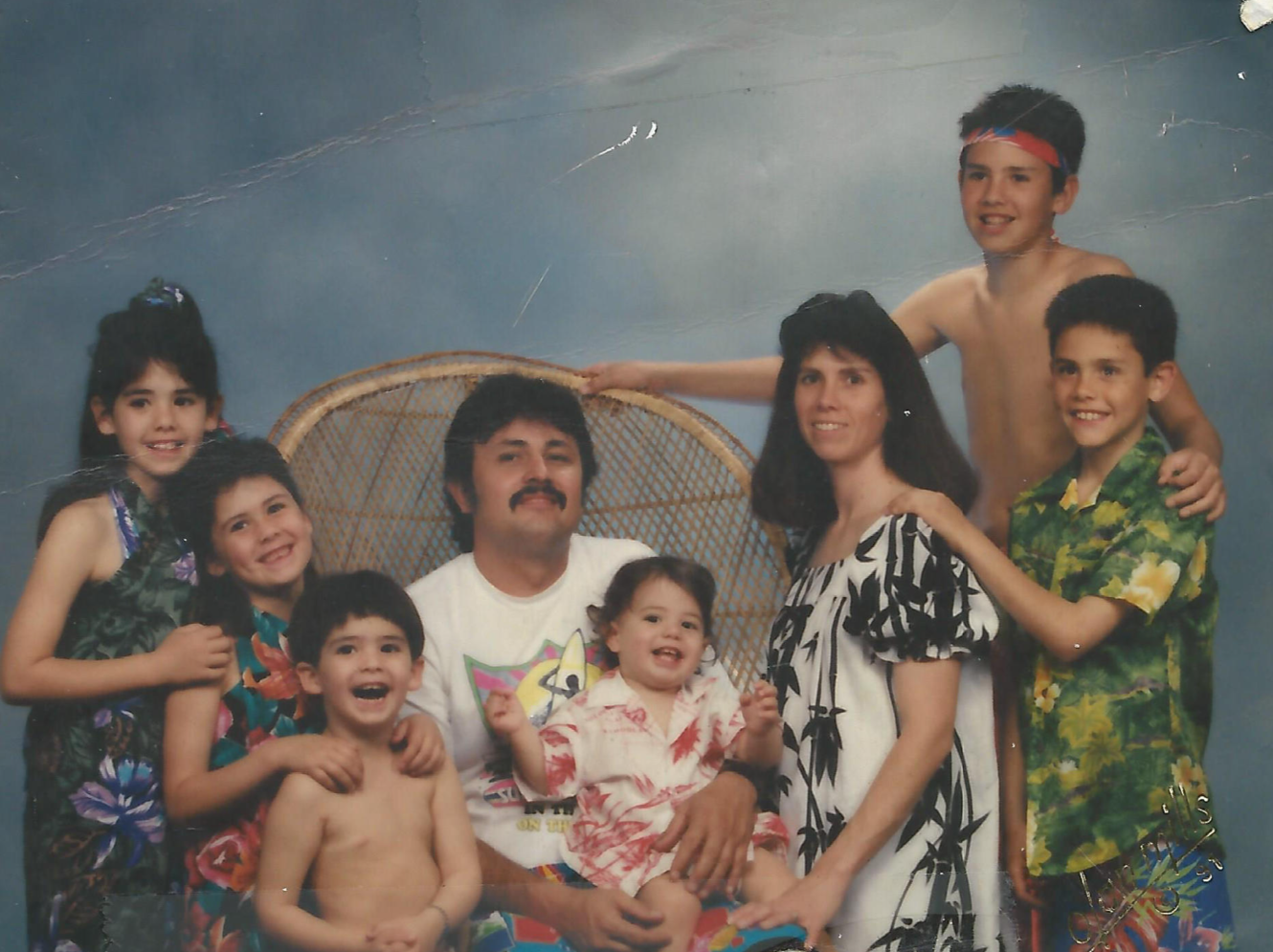 Steve and Cindy with their children in a family portrait